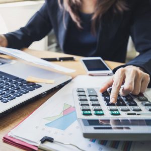 Person working at a desk office business financial accounting