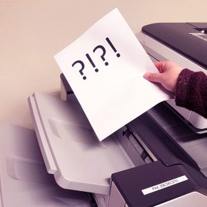 A fax with ?!?! comes out of the fax machine