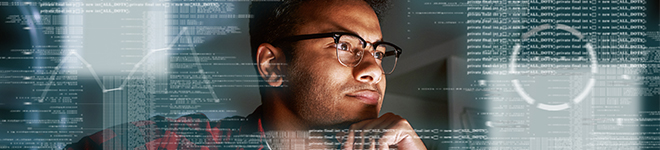 Man with glasses thinking intently surrounded by technical and data graphics.
